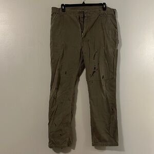 Very worn and distressed Carhartt Men's Olive carpenter pants